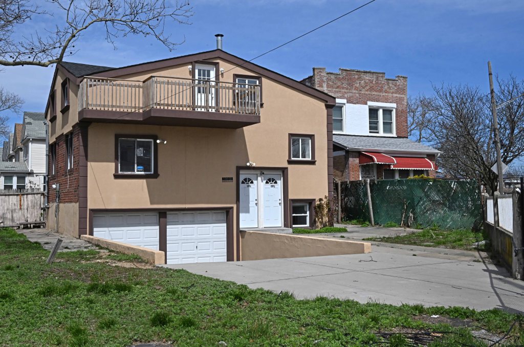 Renovated apartment owned by Juliya and Denis with a garage and driveway at 138-03 Lakewood Avenue, Jamaica, Queens, NY.