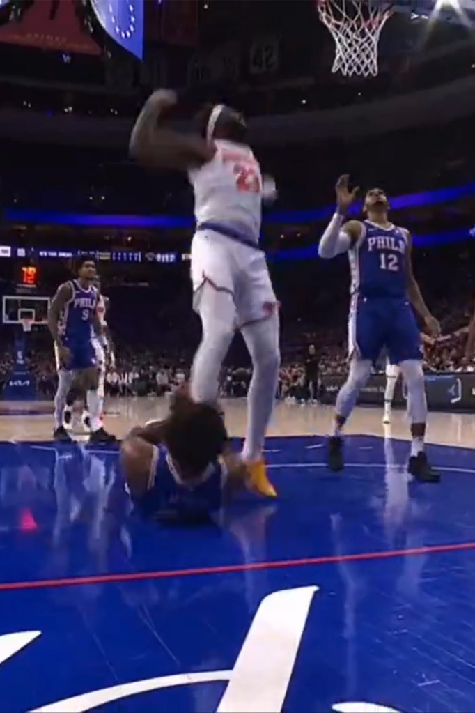 Joel Embiid appeared to grab Mitchell Robinson's lower leg.