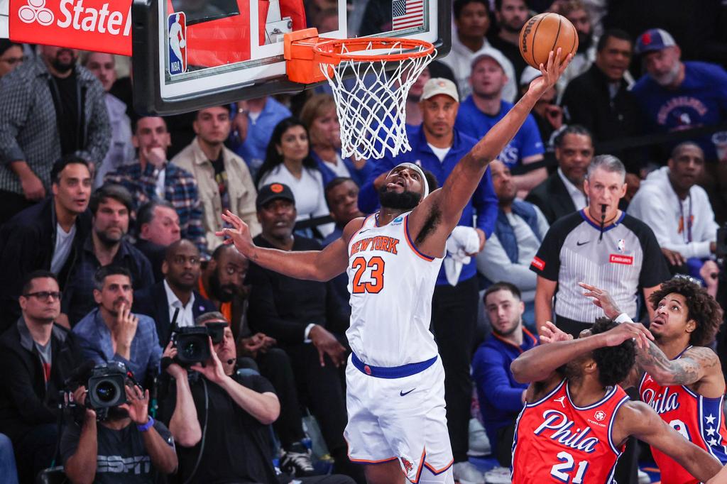 New York Knicks center Mitchell Robinson (23) goes up for a rebound in the fourth quarter against the Philadelphia 76ers in game one of the first round for the 2024 NBA playoffs at Madison Square Garden. 