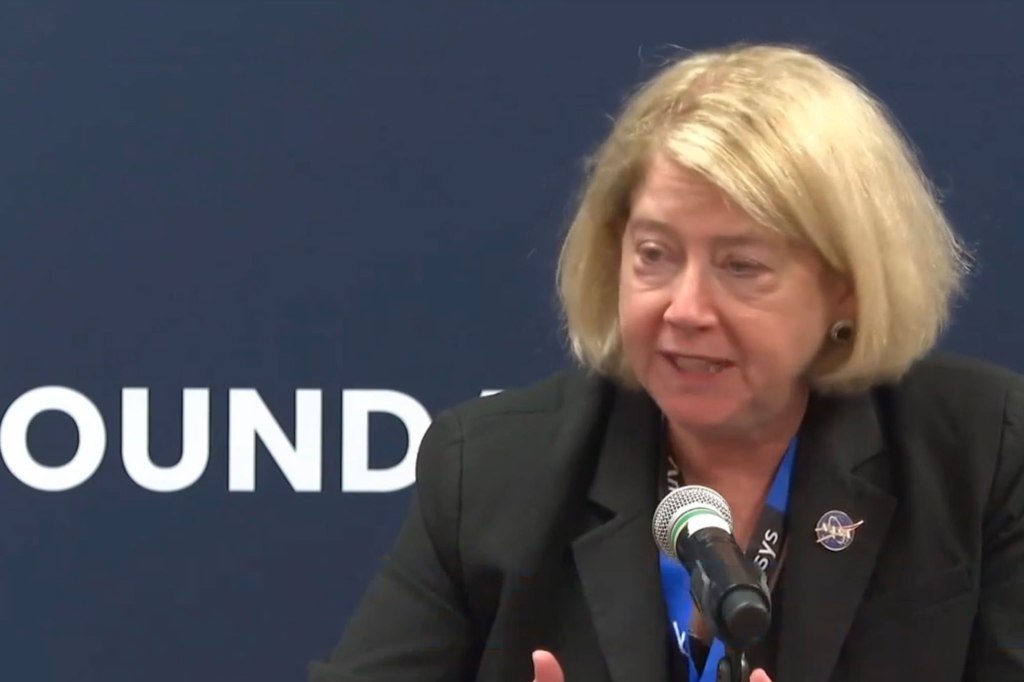 Pam Melroy, the deputy administrator of NASA, speaks into a microphone