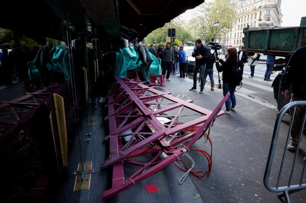 One of the iconic sails lies on the ground after it fell off the building overnight.