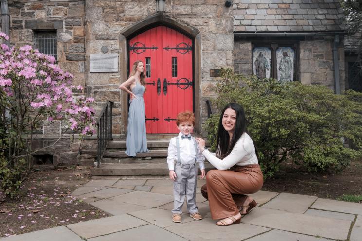 Sandra Weir, a wedding nanny from Yonkers, with redheaded boy and bridesmaid at a wedding.