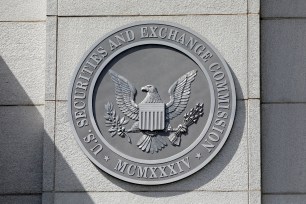 Seal of the U.S. Securities and Exchange Commission on a stone wall at their headquarters in Washington, D.C., U.S., May 12, 2021