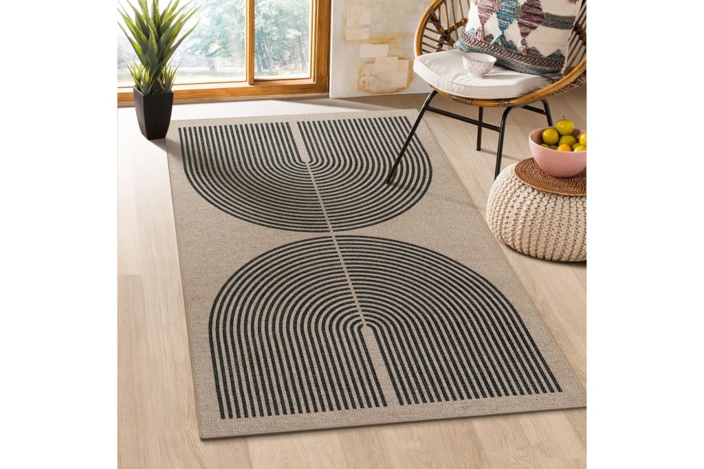 A semi-circular rug placed in a room