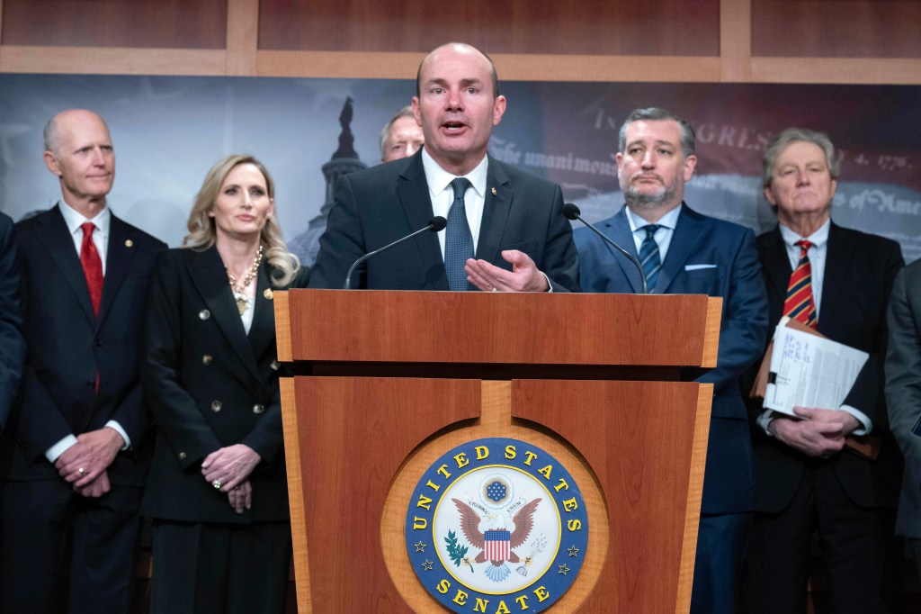 Sen. Mike Lee R-Utah, flanked by other members of congress, speaks during a news conference about the impeachment of Homeland Security Secretary Alejandro Mayorkas at the Capitol in Washington, Tuesday, April 16, 2024.