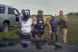 Specialist Savion Amari Donovan Johnson, 26, is seen being dragged out of the vehicle by members of the Texas Department of Public Safety and Kinney County sheriff’s deputies.