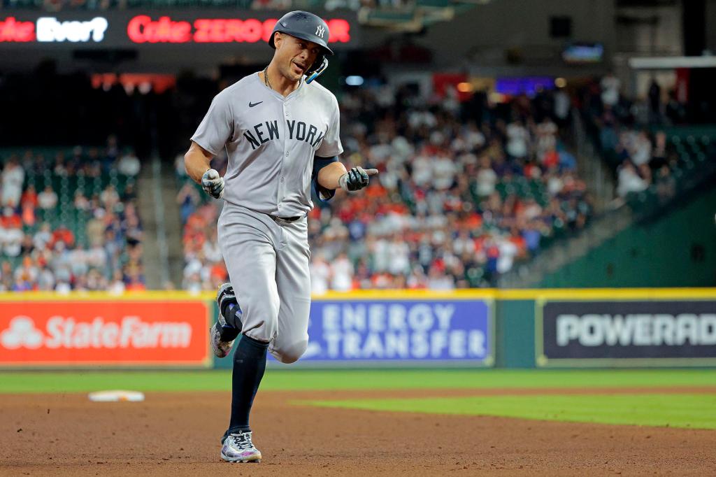 Giancarlo Stanton #27 of the New York Yankees rounds the bases on his solo homer during the 9th inning. The New York Yankees defeat the Houston Astros 7-1.