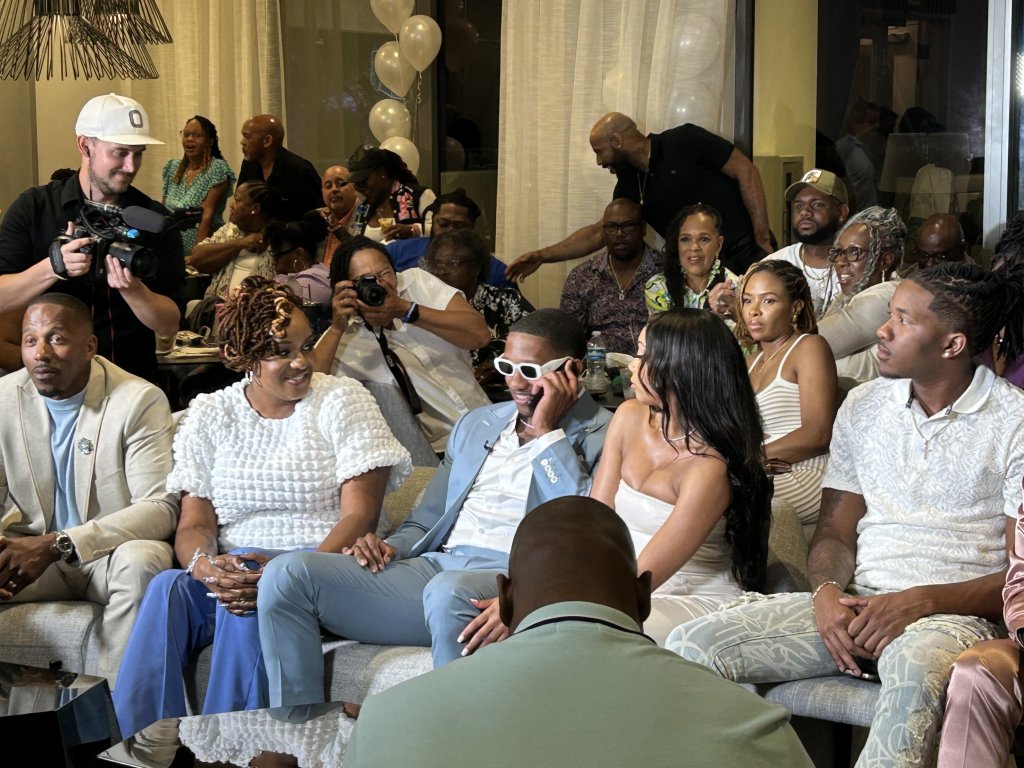 Michael Penix Jr. celebrating with his family on a couch after being picked by the Falcons in the 2024 NFL Draft