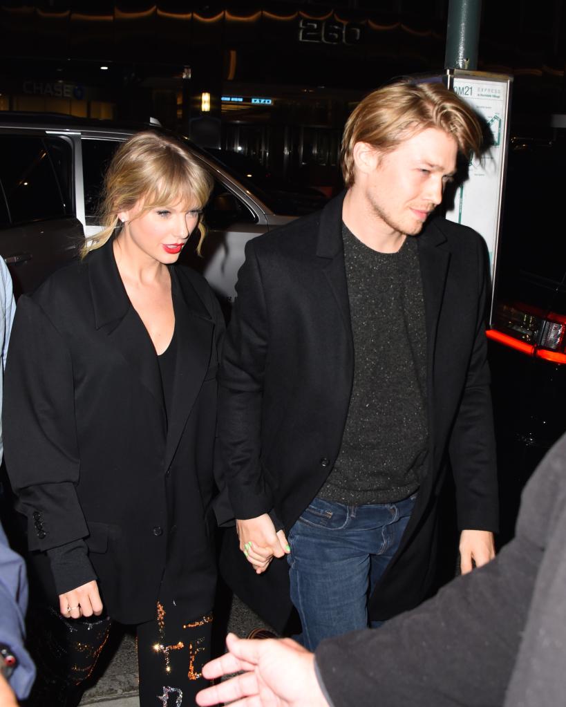 Taylor Swift and Joe Alwyn walking together in New York City, seen outside Zuma restaurant on October 6, 2019.