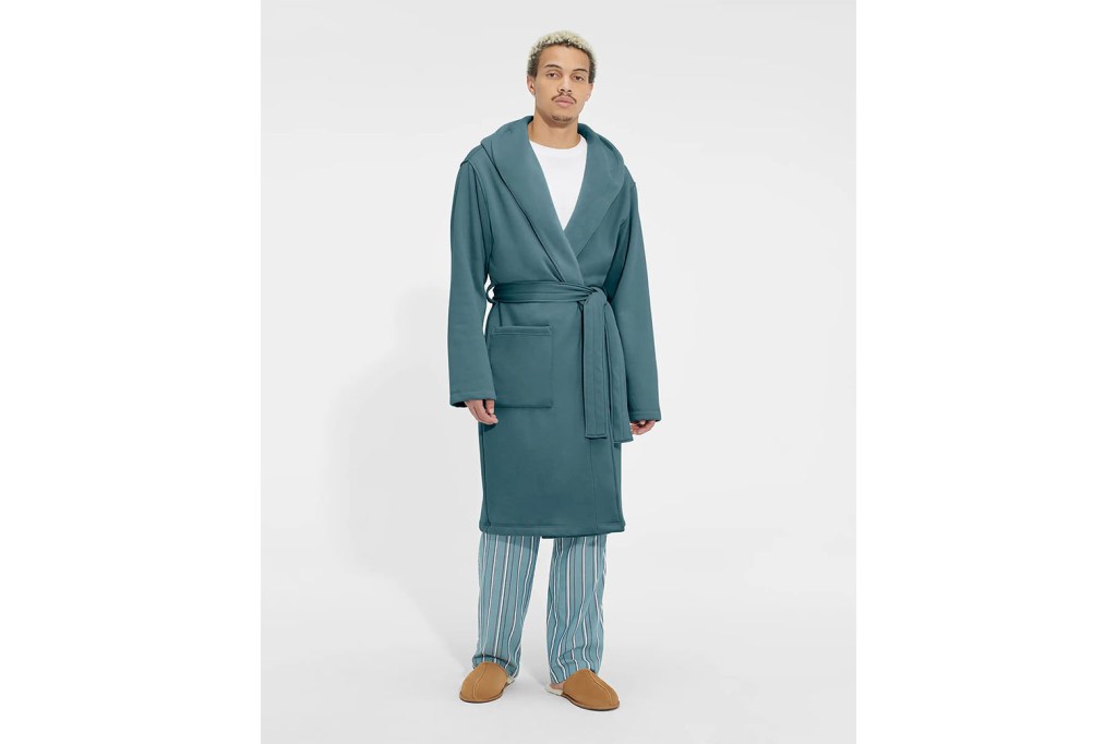 A man wearing a teal robe
