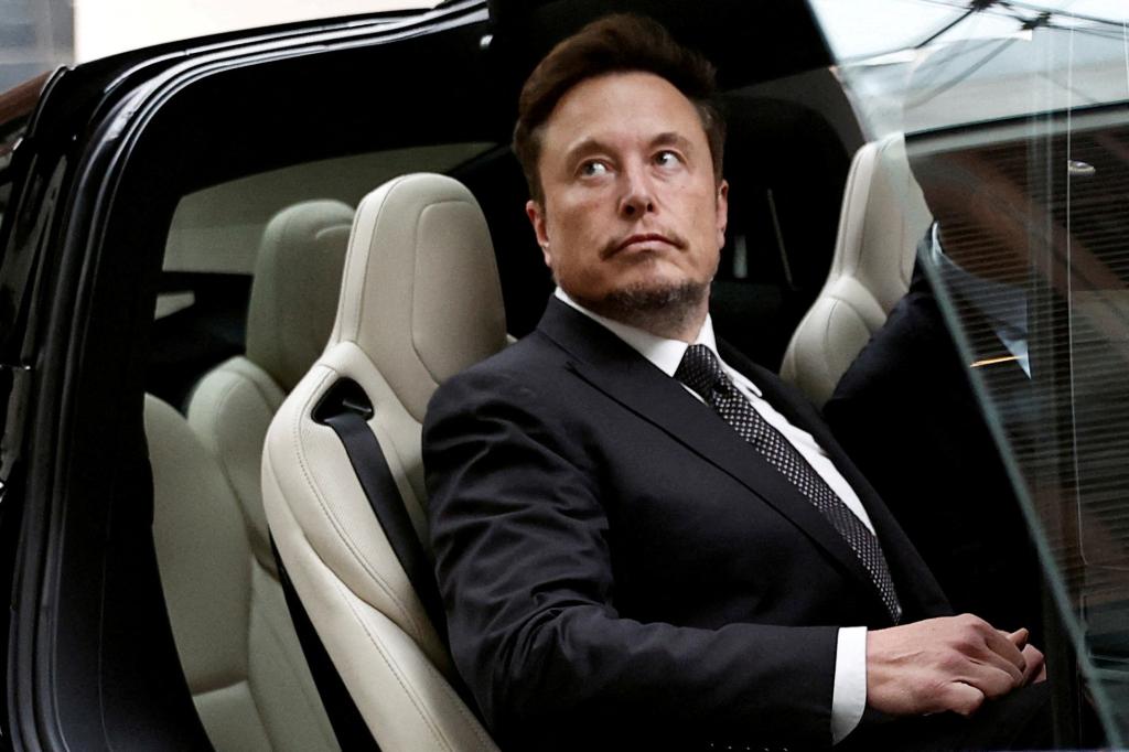 Tesla CEO Elon Musk in a suit and tie, getting into a Tesla car outside a hotel in Beijing, China on May 31, 2023.