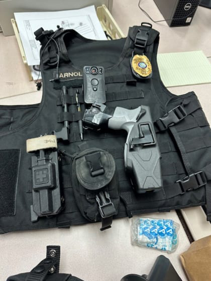 Ballistic vest and other equipment found in Arnold's possession 