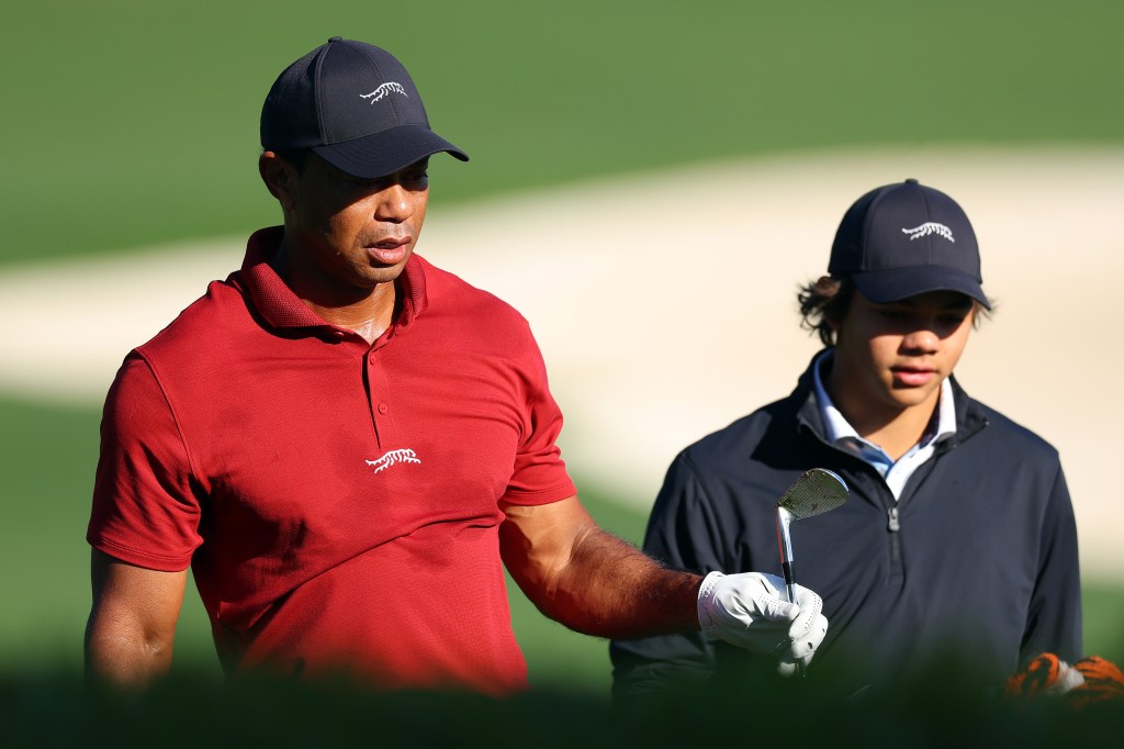 Tiger Woods and his son Charlie warming up on the practice area before the final round of the 2024 Masters Tournament