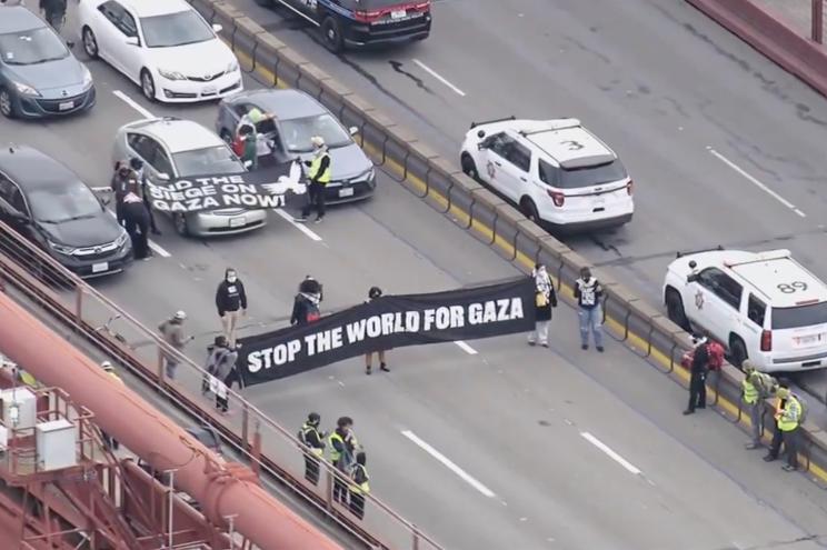 Thousands of people across Oakland, California blocked the flow of capital along the regions largest commercial interstate (I-880) in solidarity with the people of Palestine.