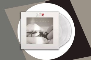 A white vinyl record with a woman lying on a bed