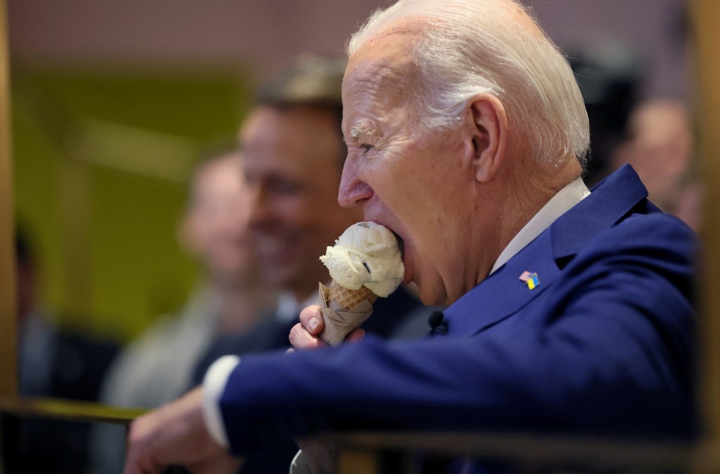 U.S. President Joe Biden enjoying an ice cream cone with Seth Meyers at Van Leeuwen Ice Cream shop in downtown New York, February 26, 2024.