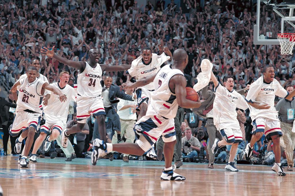 University of Connecticut celebrates at the final buzzer during the Men's National Basketball Final Four championship game held at Tropicana Field in St. Petersburg, FL. 