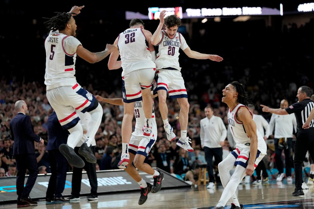 UConn celebrates their win against Purdue in the NCAA college Final Four championship basketball game, Monday, April 8, 2024, in Glendale, Ariz. 