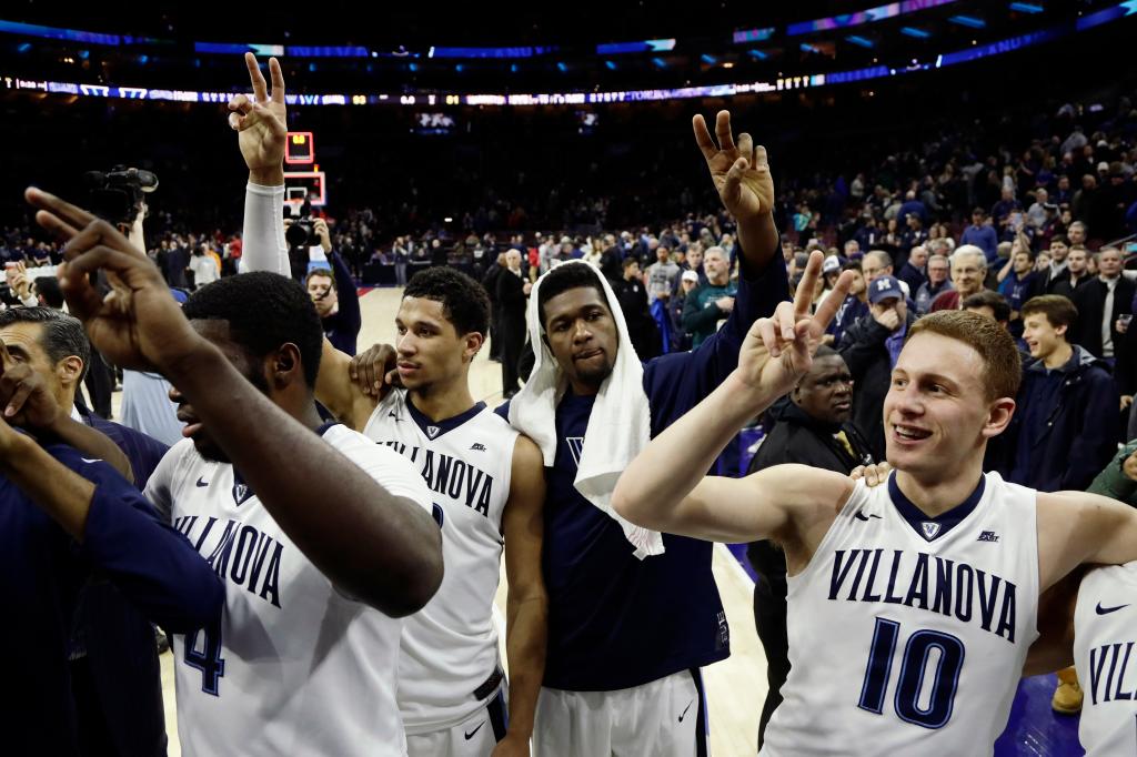 Villanova basketball players Donte DiVincenzo, Kris Jenkins, Josh Hart and Eric Paschall celebrating their win over Marquette