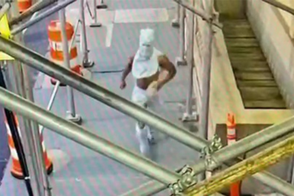The suspect seen running away after the attack.