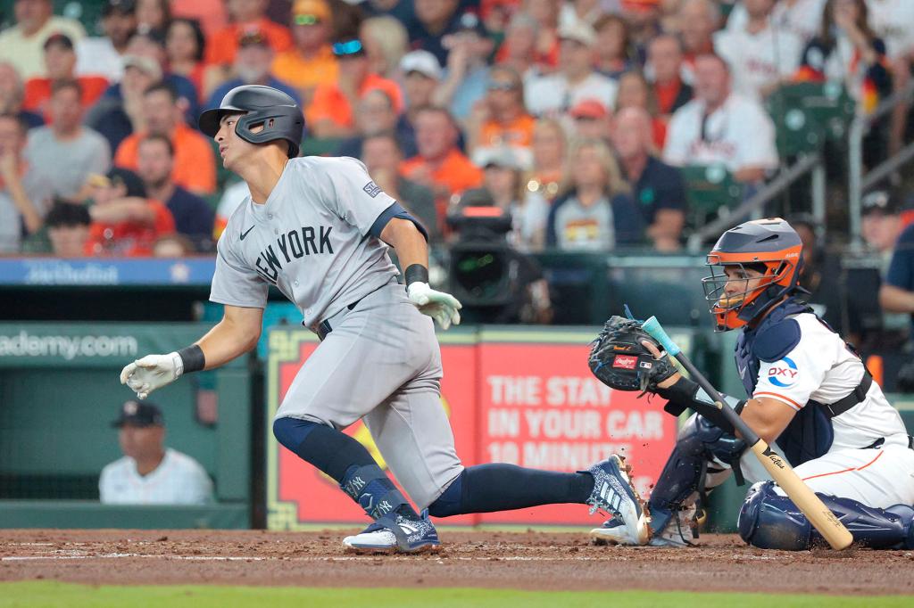 Anthony Volpe #11 of the New York Yankees hits a single during the second inning.