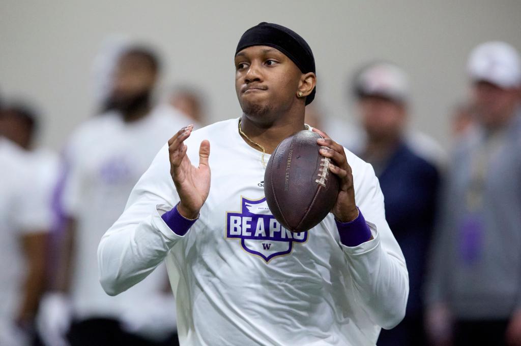 Washington quarterback Michael Penix Jr. looks to throw during the team's NFL football pro day Thursday, March 28, 2024, in Seattle.  