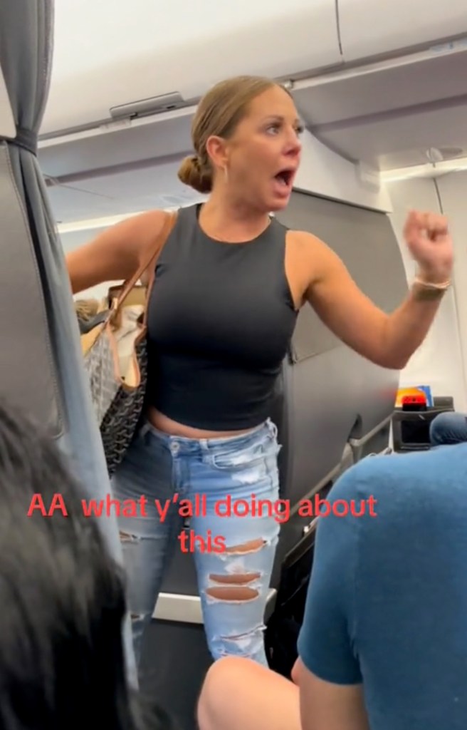 Woman in a black shirt and ripped jeans during an airplane meltdown