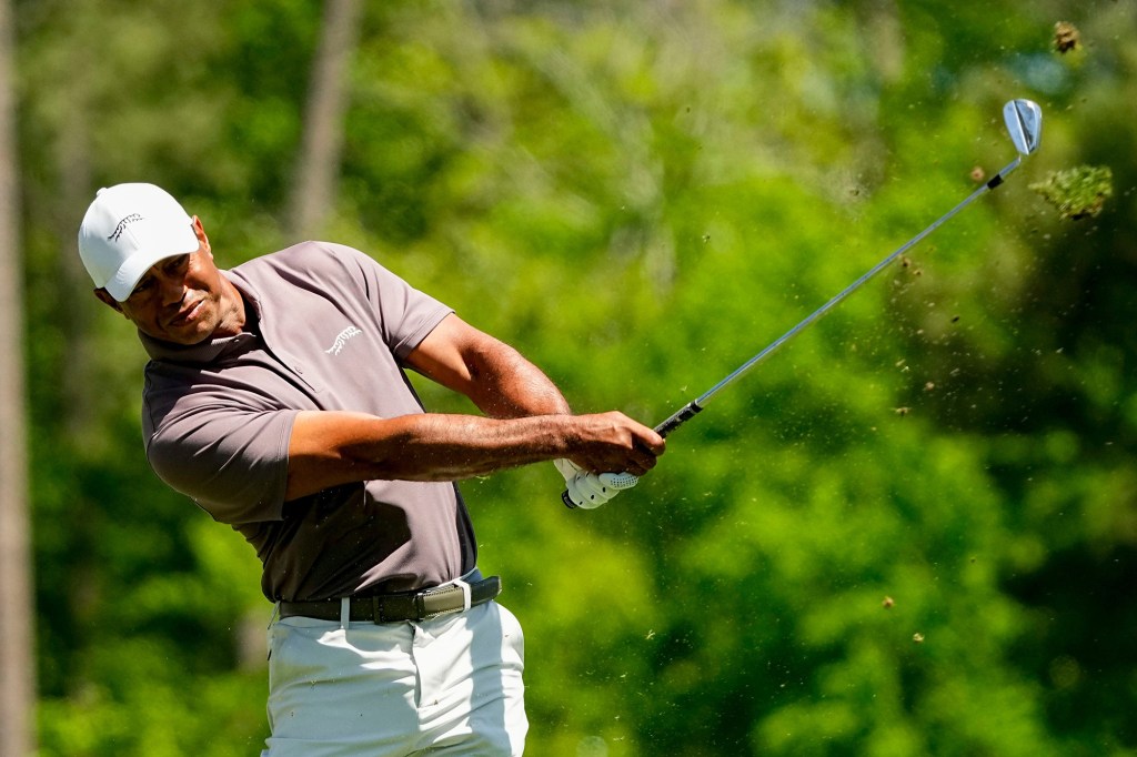 Tiger Woods swings during his second round at the Masters on Friday.