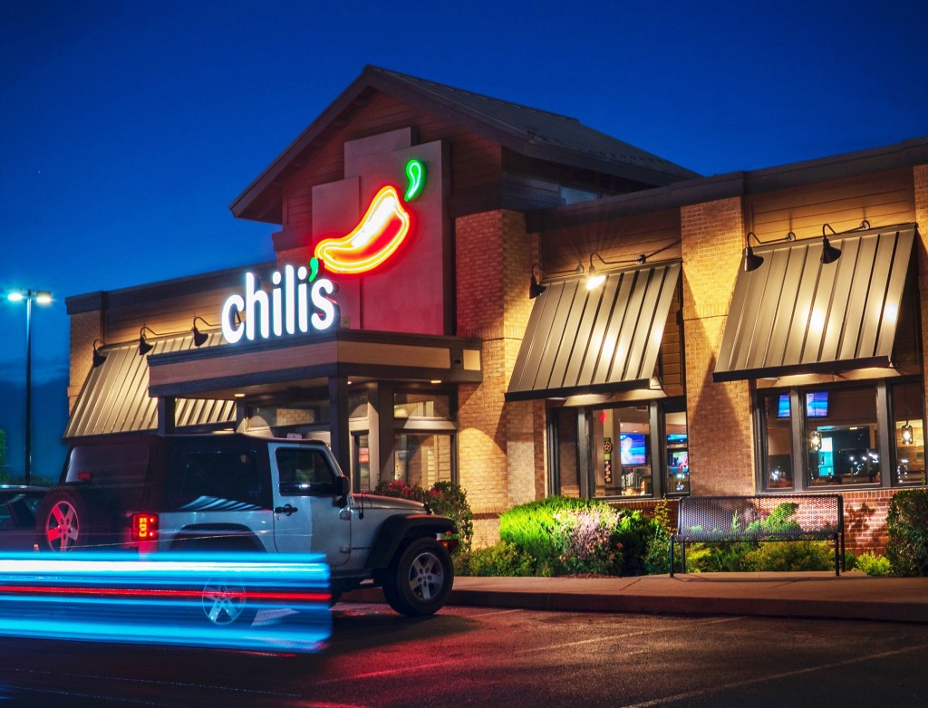 A car parked in front of Chili's Grill & Bar restaurant