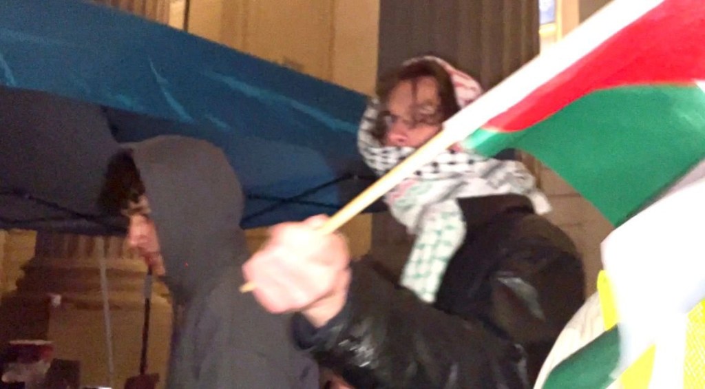 A protester used a Palestinian flag to stab a student journalist in the eye during a heated demonstration in Yale on Saturday night.