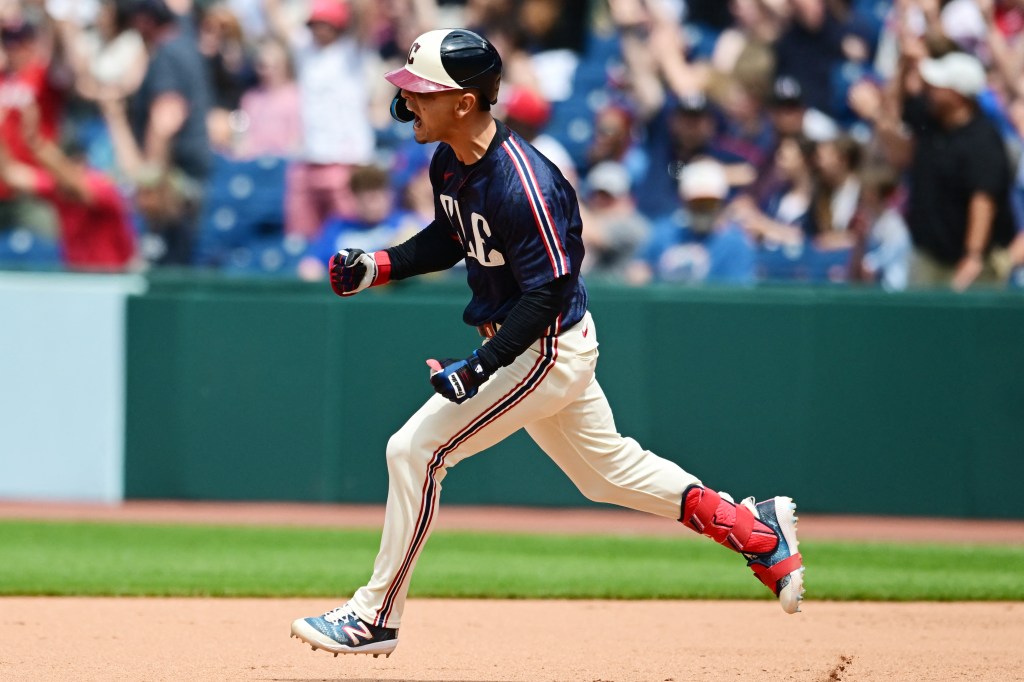 Guardians second baseman Andres Gimenez (0) celebrates after hitting a three run home run during the sixth inning