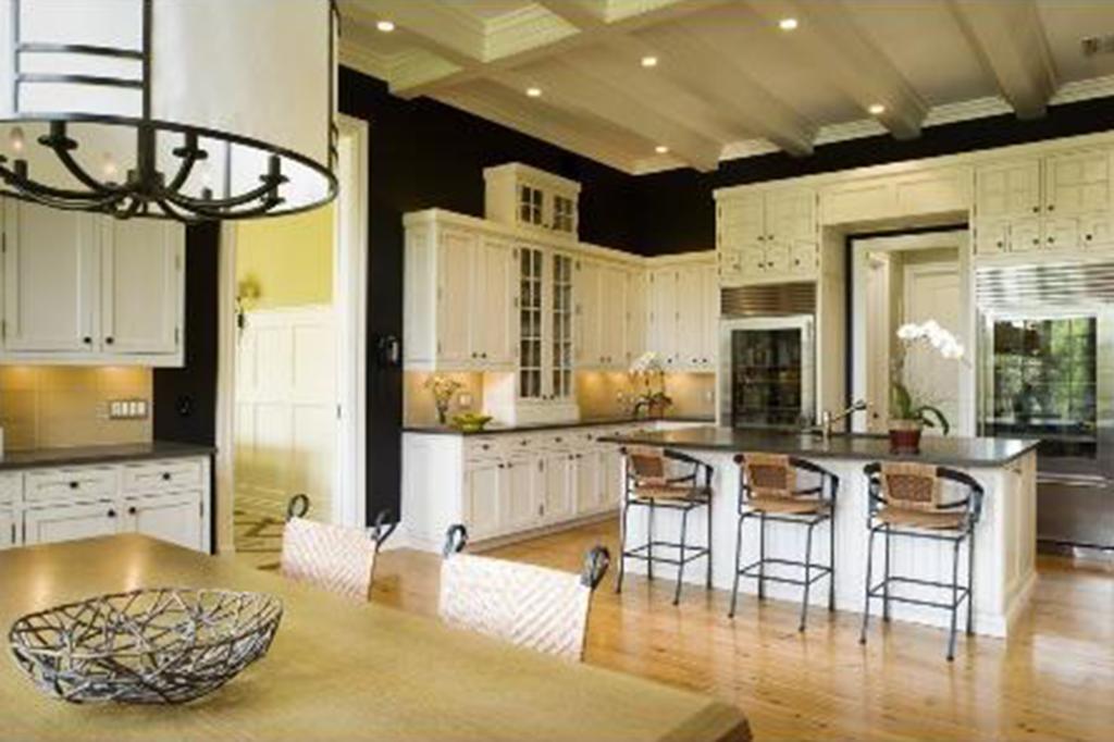 The open floor plan features a sleek kitchen and dining room area. 
