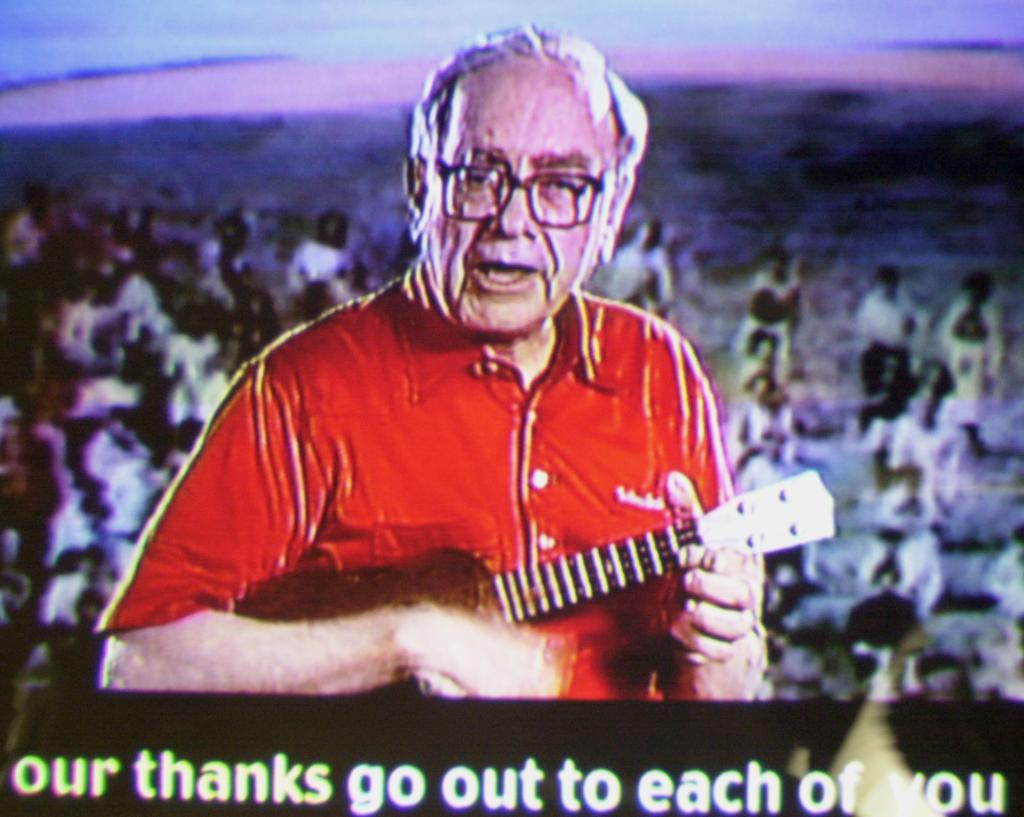 Warren Buffett singing and playing a ukulele at the annual Berkshire Hathaway shareholders meeting in Omaha, Nebraska