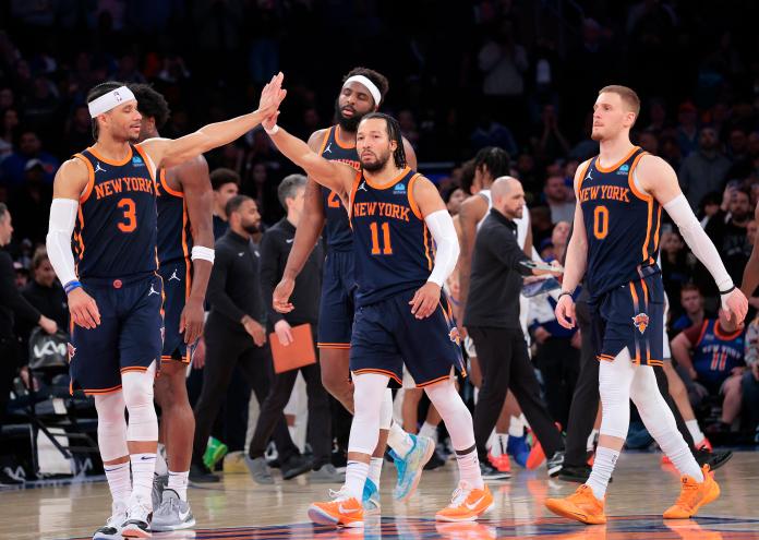 New York Knicks guard Jalen Brunson #11 is greeted by New York Knicks guard Josh Hart #3 during the fourth quarter. The New York Knicks defeated the Brooklyn Nets 111-107.