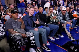 New York Yankees pitcher Marcus Stroman, pitcher Clarke Schmidt, right fielder Juan Soto, Gleyber Torres #25, and pitcher Nestor Cortes sit on celebrity row and record a shout out for the Knicks before the start of tonight's game.