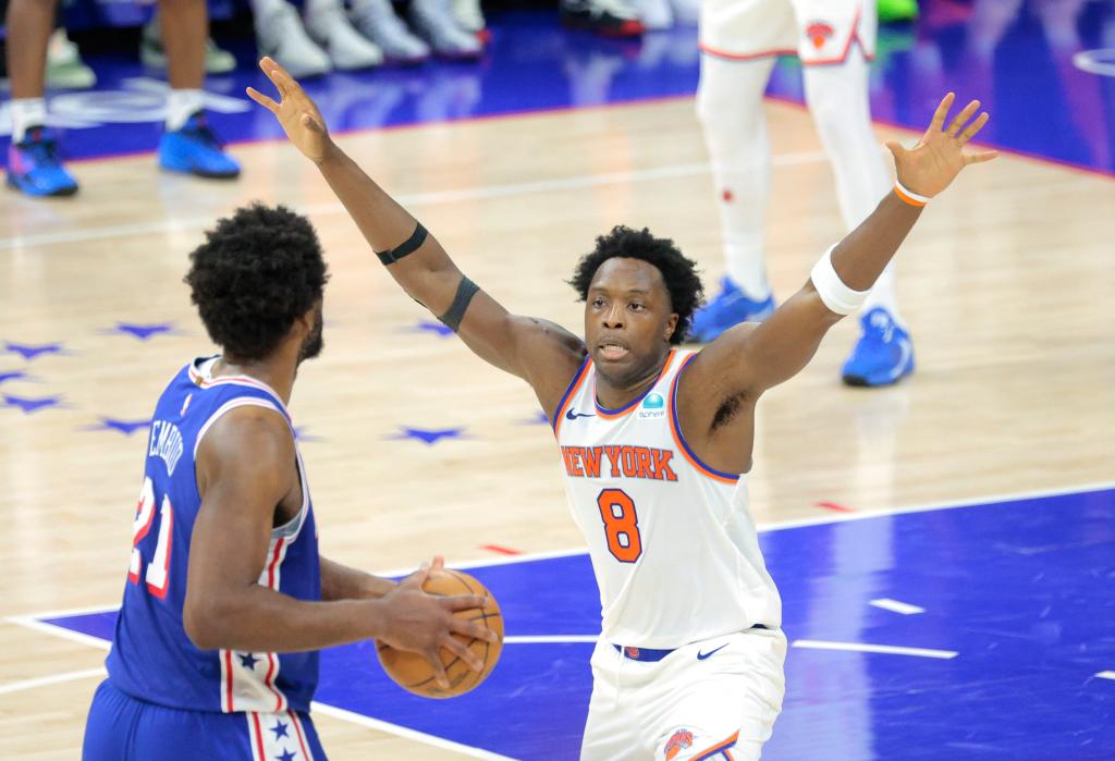 OG Anunoby #8 of the New York Knicks defends against Joel Embiid #21 of the Philadelphia 76ers during the third quarter.