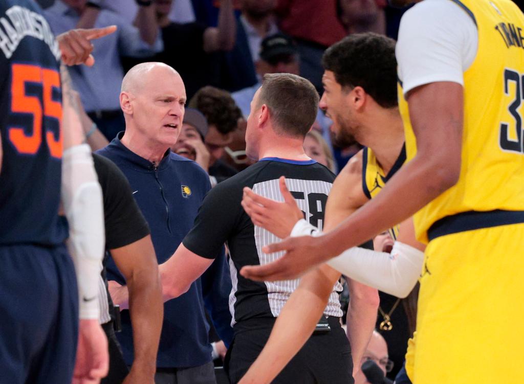 Indiana Pacers head coach Rick Carlisle speaks with referee Josh Tiven #58 after a call during the fourth quarter. 