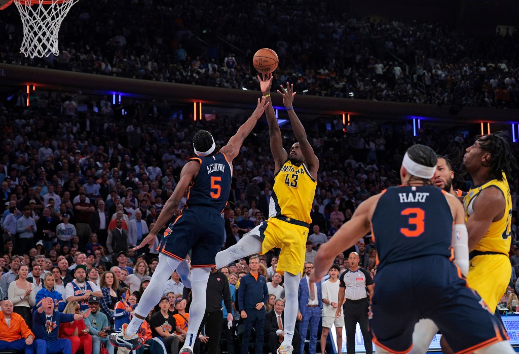 Indiana Pacers forward Pascal Siakam #43 puts up a shot as New York Knicks forward Precious Achiuwa #5 jumps to defend during the fourth quarter. 