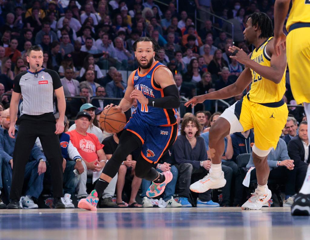 New York Knicks guard Jalen Brunson #11 drives down court during the first quarter.