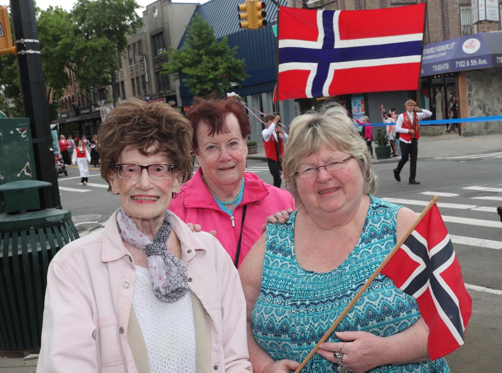 Irene Jacobsen, Mary Owens, and Maude aMac Stoker along with others celebrating the Norwegian-Americans 70th year-parade on 5th Avenue in Brooklyn
