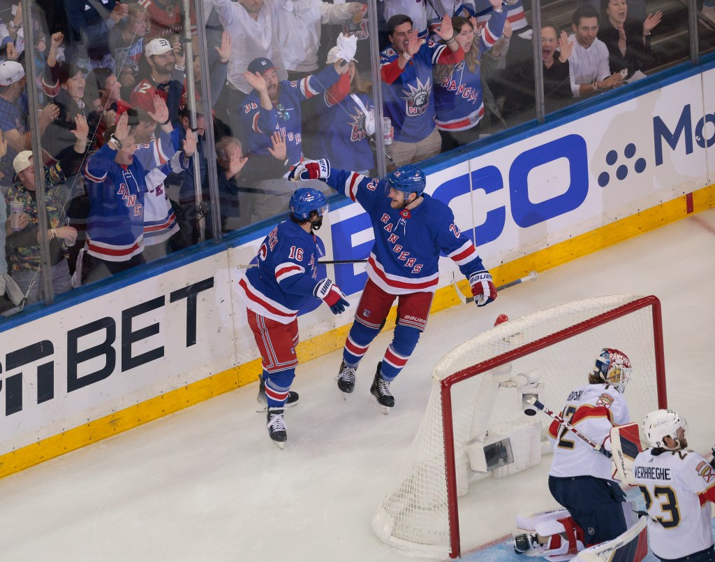 Vincent Trocheck #16 of the New York Rangers celebrates with Adam Fox #23 of the New York Rangers after he scores a goal 