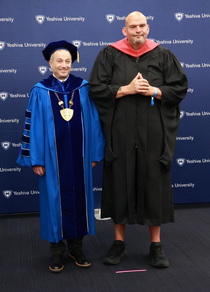 Senator John Fetterman receiving the presidential medal from the President of the Yeshiva University at the Louis Armstrong Stadium in Flushing, NY