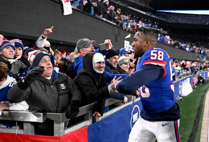New York Giants linebacker Bobby Okereke (58) greets fans as he comes off the field at the end of the fourth quarter. The New York Giants defeat the Green Bay Packers 24-22 in East Rutherford, NJ.
