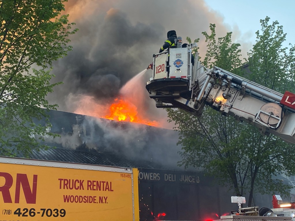 Firefighters respond to fire at Bushwick supermarket. 