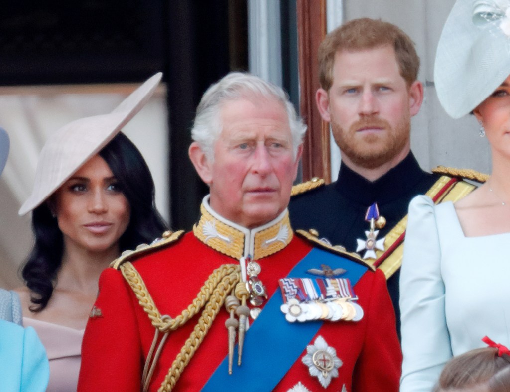 Meghan, Duchess of Sussex, Prince Charles, Prince of Wales and Prince Harry, Duke of Sussex standing on the balcony of Buckingham Palace during Trooping The Colour 2018 event.