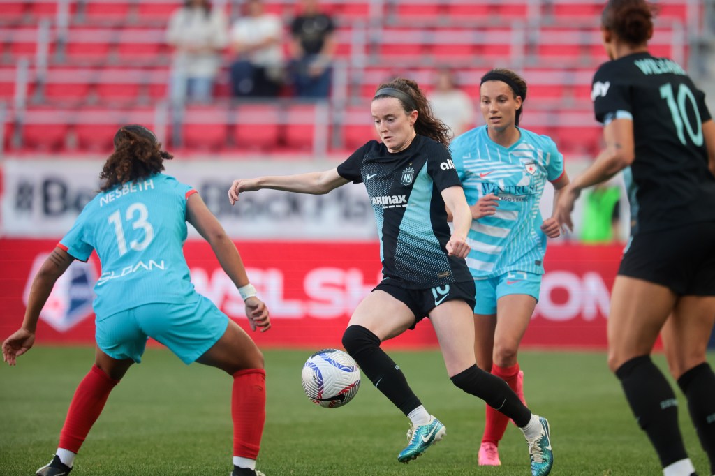 Rose Lavelle (16) attempts to dribble the ball past Chicago Red Stars midfielder Leilanni Nesbeth (13) during the first half at Red Bull Arena. 