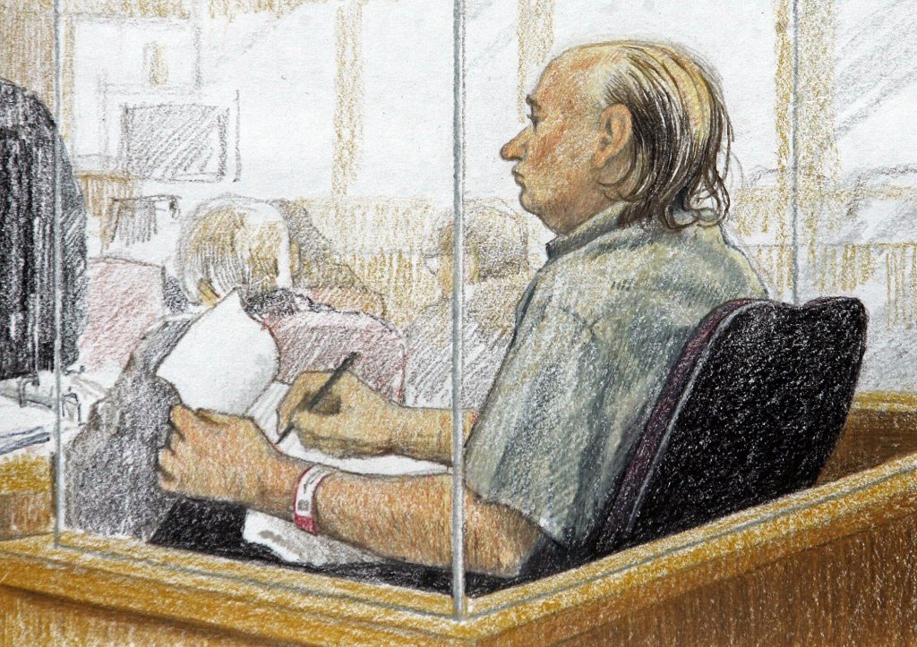 This artist's sketch shows accused serial killer Robert Pickton taking notes during the second day of his trial in 2006.