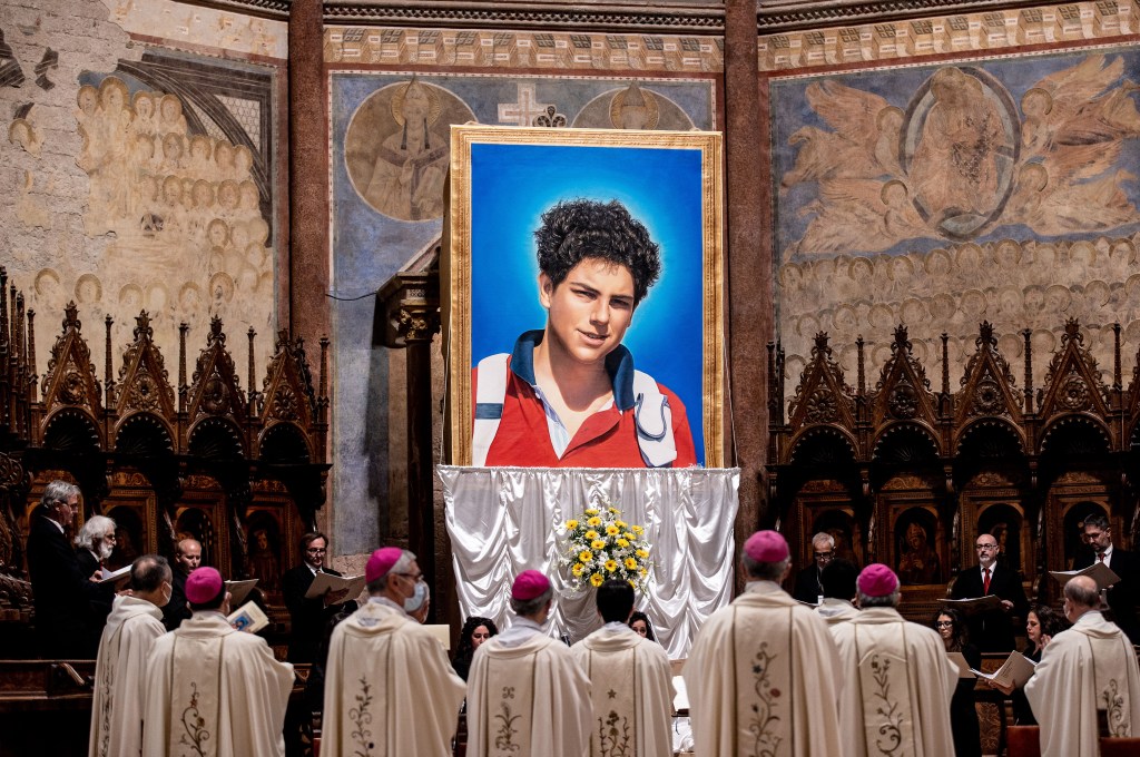 A tapestry featuring a portrait of Carlo Acutis is hang at the St. Francis Basilica during the beatification ceremony of Carlo Acutis, on October 10, 2020 in Assisi, Italy.