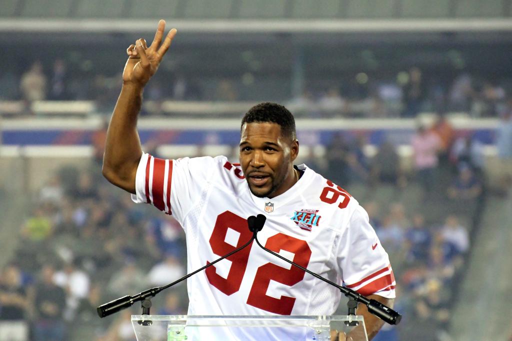 Michael Strahan holds the NFL record of 22.5 sacks in a season. 