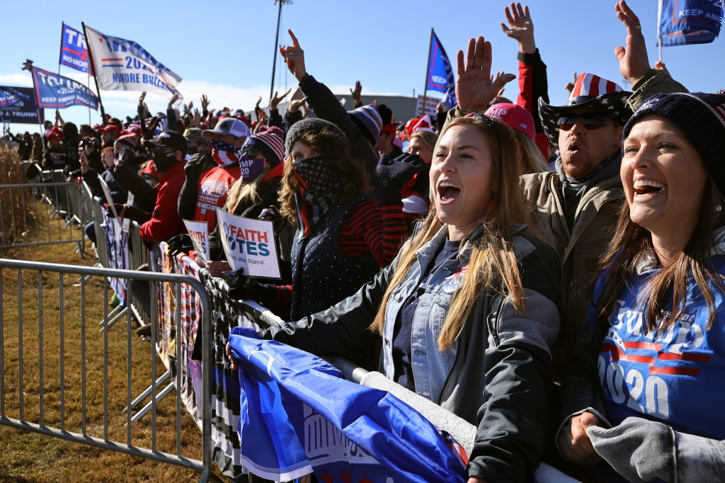 Supporters of U.S. President Donald Trump gather outside a campaign rally with the president at Rochester International Airport October 30, 2020 in Rochester, Minnesota.